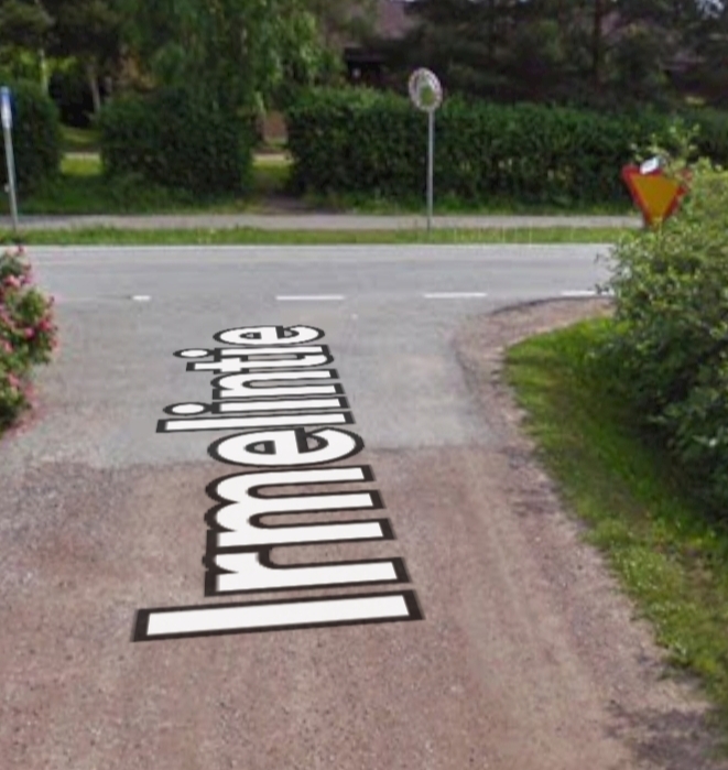 Kuva Irmelintie Vihti. Tiessä näkyy Irmelintien nimi ja varoituskolmio. 